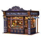Notting Hill Bookstore book nook viewed from an angle, showing lit shelves and a side awning